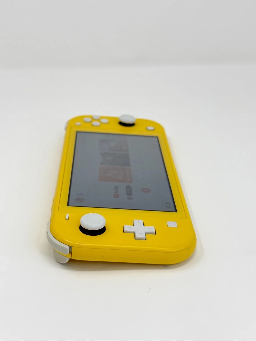 Nintendo Switch Lite Yellow Handheld Gaming Console with White Buttons